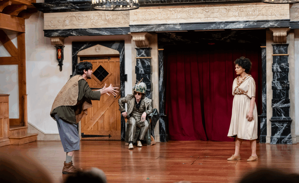 Corrie Green as Helena, Philip Orazio as Demetrius, Aidan O'Reilly as Obero, invisible while observing the lovers in A Midsummer Night's Dream by William Shakespeare at the American Shakespeare Center in 2024. Photo by October Grace Media.