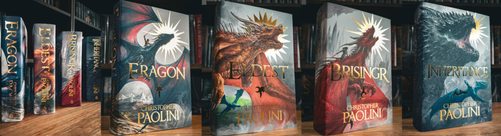 The Eragon cover collection with four books standing on display, all featuring dragons.
